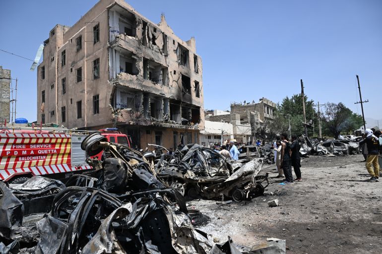 Security officials inspect the site after an explosion that targeted a train in Quetta on May 24, 2026.