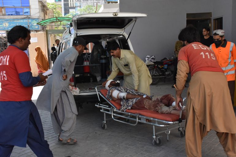 Volunteers transport an injured victim at a hospital after an explosion targeted a train in Quetta on May 24, 2026.