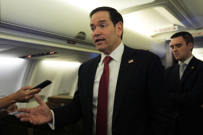 afp_6a1528b19a54-1779771569 US Secretary of State Marco Rubio speaks to reporters onboard his plane at Jaipur International Airport in Jaipur on May 26, 2026. (Photo by Julia Demaree Nikhinson / POOL / AFP)