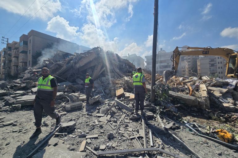 Lebanese civil defence workers search through the rubble of a building following an Israeli strike at dawn in the southern Lebanese area of al-Hosh, near the coastal city of Tyre on May 26, 2026.