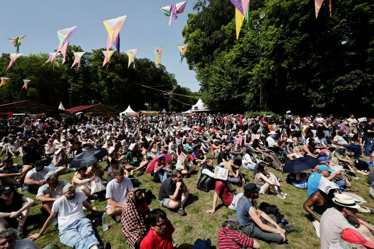 Supporters of French far-left party Lutte Ouvriere (LO) presidential candidate Nathalie Arthaud attend to her campaign kickoff event in Presles, north of Paris on May 24, 2026.
