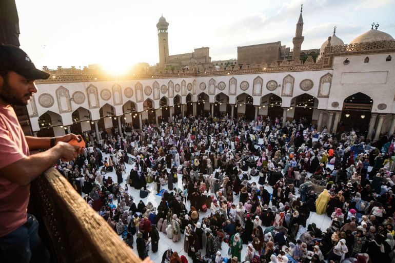 EDITORS NOTE: Graphic content / Muslims gather to take part in a special morning prayer at the Al-Azhar Mosque in Cairo on May 27, 2026, to start Eid al-Adha, the Feast of Sacrifice, marking the end of the annual Hajj pilgrimage to Mecca and commemorating the Prophet Abraham’s willingness to sacrifice his son in obedience to God. (Photo by Ahmed HASAN / AFP)
