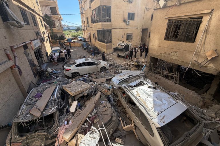Rescue workers and local residents inspect the damage to a building following an Israeli air strike in the Choueifat area, south of Beirut on the outskirts of the capital’s southern suburbs, on May 28, 2026.