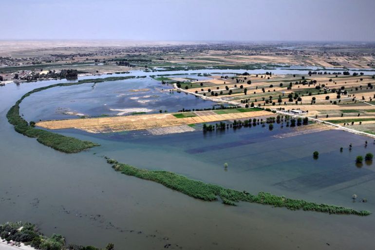 TOPSHOT - This handout picture released by the official Syrian Arab News Agency (SANA) on May 28, 2026, shows an inundated area in Syria's Deir Ezzor province following recent flooding as water levels rise from the Euphrates river.