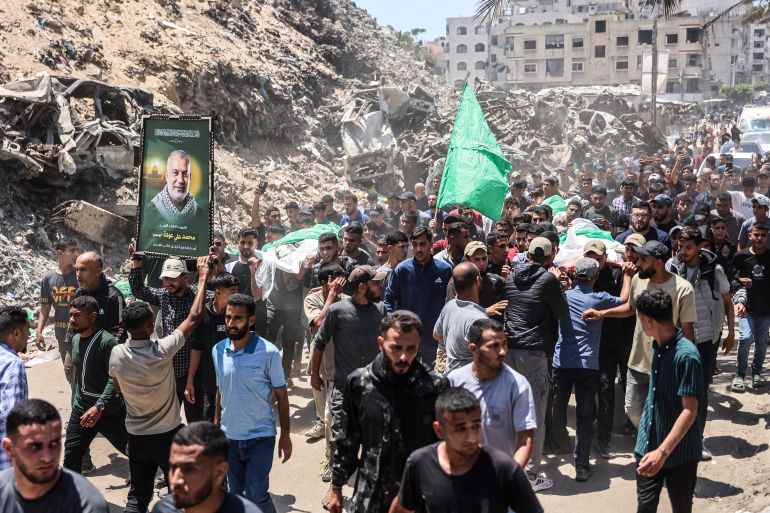 afp_6a1c0ebc0c52-1780223676 CORRECTION / Mourners carry the body of Hamas leader Mohammed Odeh and other Palestinians, the day after his targetted assassination in the Rimal neighborhood by the Israeli army, during his their funeral in Gaza City on May 27, 2026.