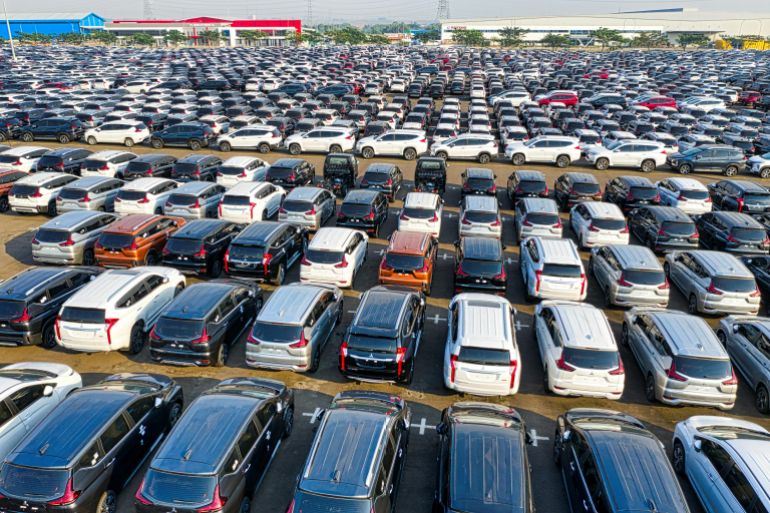 Aerial view of a large car lot with parked vehicles in Bekasi Regency, West Java.