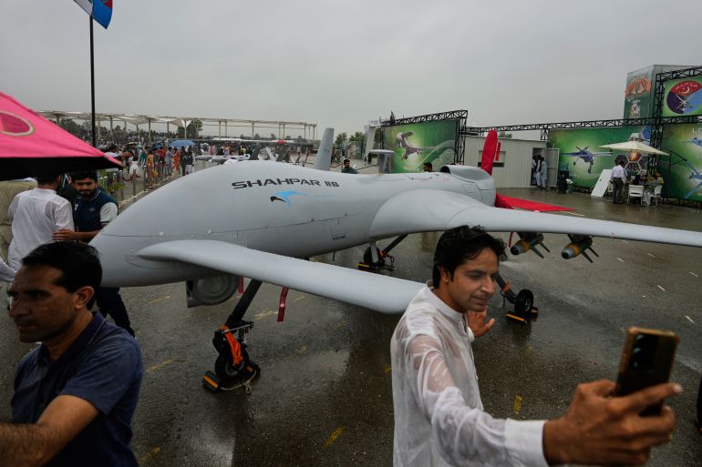 ap25226340463796-1780234938 A visitor takes selfie with an unmanned drone 'Shahpar' during a defense exhibition held as part of Pakistan's Independence Day celebrations, in Islamabad, Pakistan, Thursday, Aug. 14, 2025. (AP Photo/Anjum Naveed)