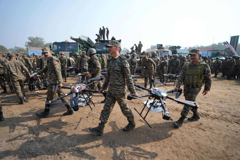 ap26057445953862-1780234933 Indian army soldiers carry drones during an operational drill in Pathankot, India, Thursday, Feb. 26, 2026. (AP Photo/Channi Anand)
