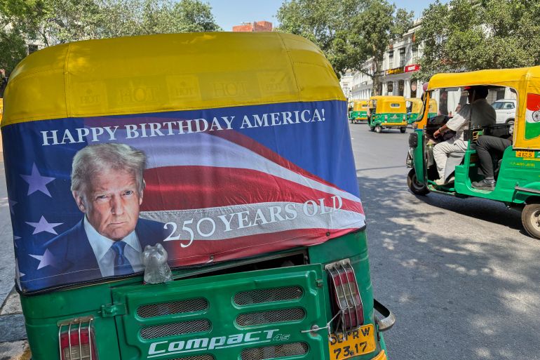 ap26140276220615-1779312975 An auto-rickshaw displays a poster of U.S. President Donald Trump that celebrates "250 Years of America" on the back of vehicle in New Delhi, India, Wednesday, May 20, 2026. (AP Photo/Shonal Ganguly)