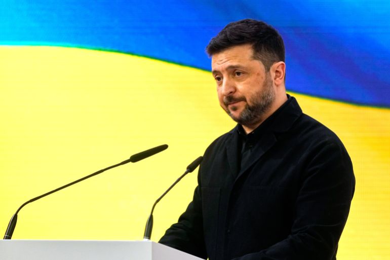 ap_6990f07798a03-1771106423 Ukraine's President Volodymyr Zelenskyy addresses the audience during a session at the Munich Security Conference in Munich, Germany, Saturday, Feb. 14, 2026. (AP Photo/Michael Probst)