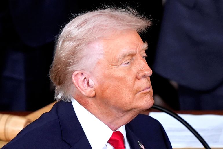 Redness is seen on the neck of President Donald Trump as he delivers the State of the Union address to a joint session of Congress in the House chamber at the U.S. Capitol in Washington, Tuesday, Feb. 24, 2026. (AP Photo/Mark Schiefelbein)