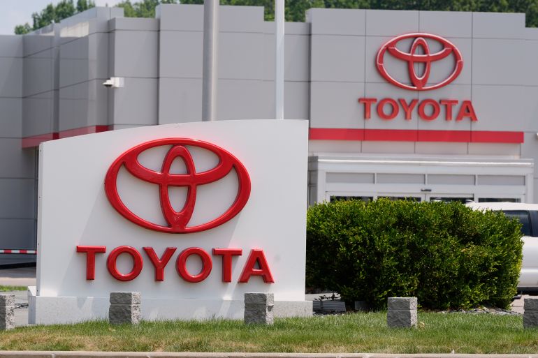 Signs are pictured at a Toyota dealership in Bedford, Ohio Tuesday, July 8, 2025. (AP Photo/Sue Ogrocki)