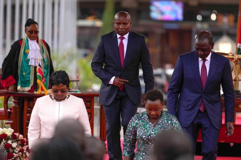 ap_69f9cfb151e79-1777979313 Kenya's new Deputy President Kithure Kindiki, center, walks from the podium with Kenyan President William Ruto, right, after he was sworn-in office at a ceremony held at Kenyatta International Convention Centre, in Nairobi, Kenya Friday, Nov. 1, 2024. (AP Photo/Brian Inganga)