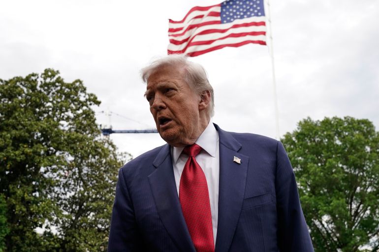 President Donald Trump speaks to reporters as he walks to board Marine One on the South Lawn of the White House, Friday, May 8, 2026, in Washington. (AP Photo/Jose Luis Magana)