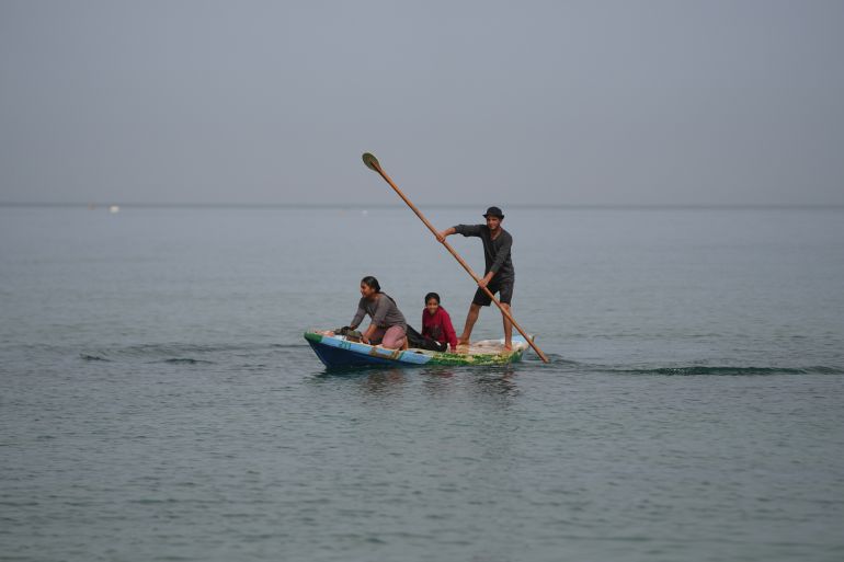 ap_6a045ad45daf3-1778670292 Palestinians ride a small boat in the Mediterranean Sea during a heatwave, in Zawaida, central Gaza Strip, Tuesday, May 12, 2026. (AP Photo/Abdel Kareem Hana)