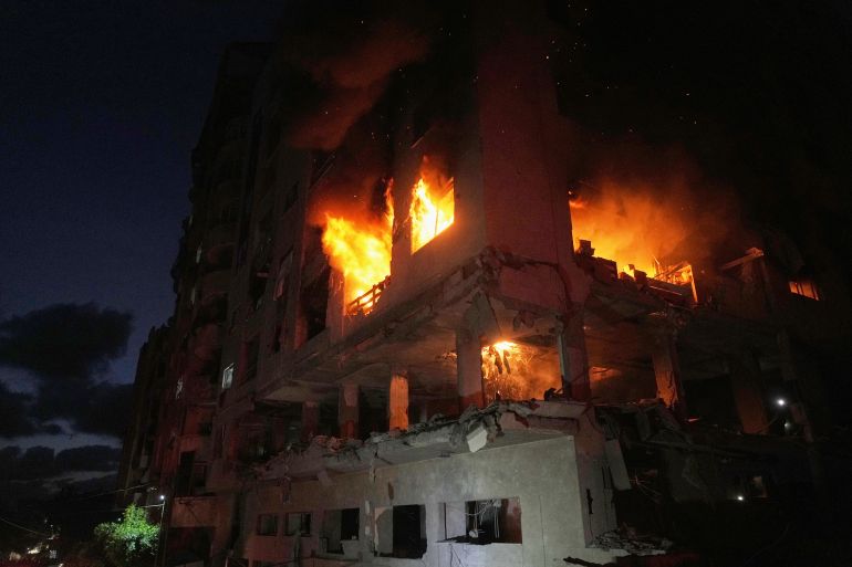 ap_6a0771abd8cd8-1778872747 Flames engulf a residential building following an Israeli strike in the Rimal neighborhood in Gaza City, Friday, May 15, 2026. (AP Photo/Jehad Alshrafi)