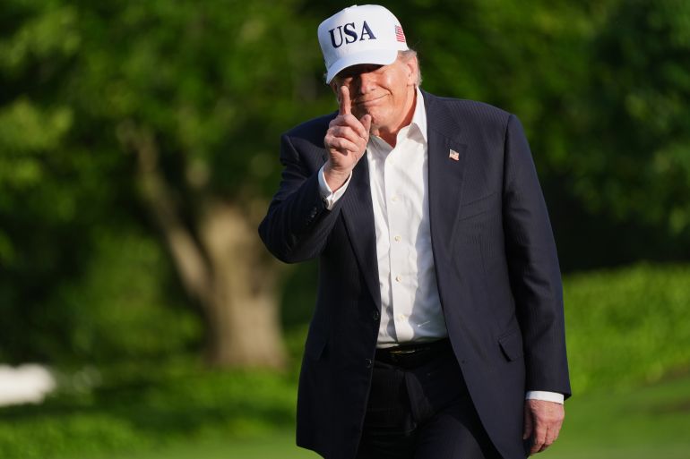 ap_6a0a1f3306308-1779048243 President Donald Trump gestures to reporters as he walks across the South Lawn of the White House, Friday, May 15, 2026, in Washington, on return from Beijing where he met with China's President Xi Jinping. (AP Photo/Jacquelyn Martin)
