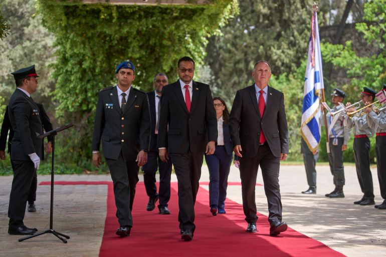 ap_6a0b19862b844-1779112326 Somaliland's Ambassador to Israel, Mohamed Hag, center, arrives to the presidential residence in Jerusalem, Monday, May 18, 2026. (AP Photo/Ohad Zwigenberg)