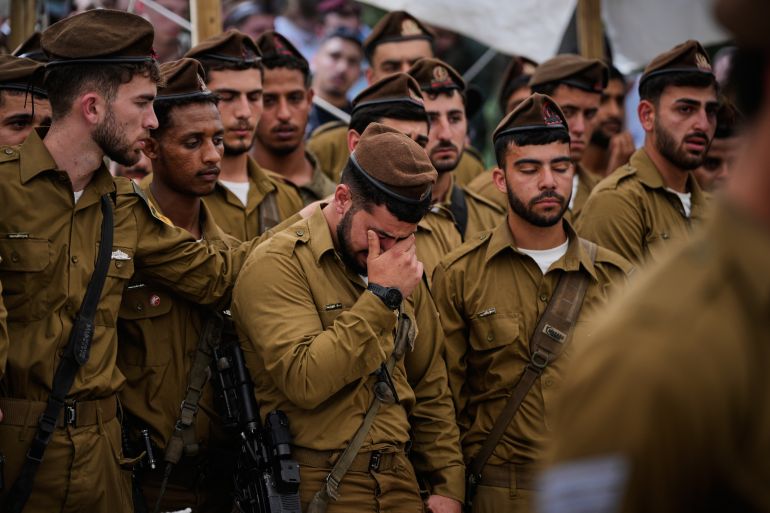 ap_6a0c77d05a549-1779202000 Israeli soldiers attend the funeral of Capt. Maoz Israel Recanati, who was killed in a Lebanese drone attack in southern Lebanon, at Mt. Herzl Military Cemetery in Jerusalem Sunday, May 17, 2026. (AP Photo/Ohad Zwigenberg)
