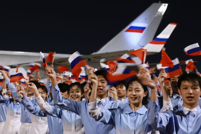 ap_6a0ca95950e89-1779214681 Chinese youth greet Russian President Vladimir Putin as he arrives in Beijing, Tuesday, May 19, 2026, for a two day visit to meet President Xi Jinping. (Vladimir Smirnov, Sputnik, Kremlin Pool Photo via AP)