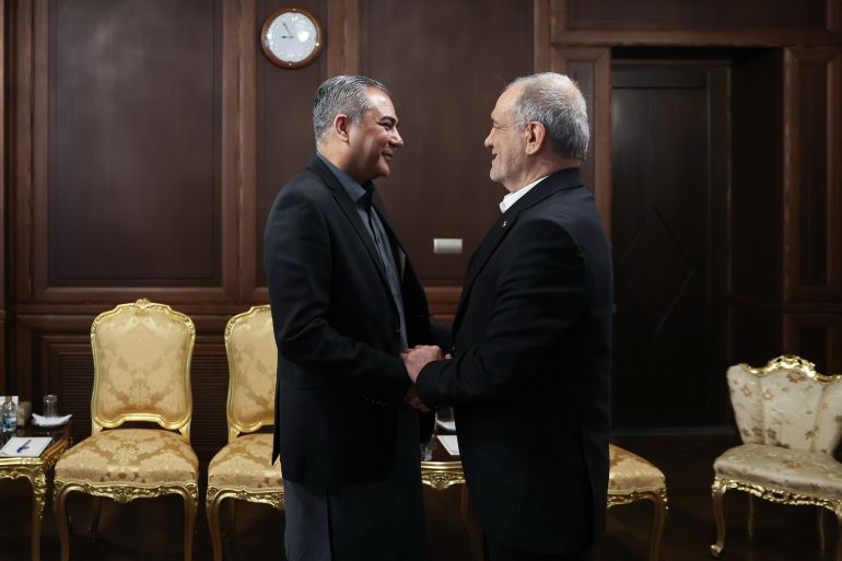 ap_6a0df52a10b03-1779299626-1 In this photo released by the Iranian Presidency Office, Iran's President Masoud Pezeshkian, right, shakes hands with Pakistan's Interior Minister Mohsin Naqvi during a meeting in Tehran, Iran, Sunday, May 17, 2026. (Iranian Presidency Office via AP)