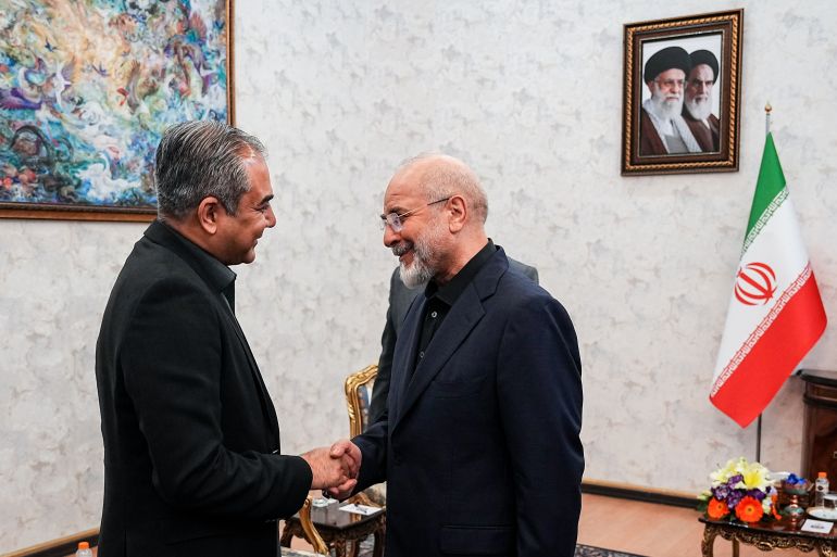 ap_6a0e4135bc769-1779319093 Iran's Parliament Speaker Mohammad Bagher Qalibaf, right, shakes hands with Pakistan's Interior Minister Mohsin Naqvi during their meeting in Tehran, Iran, Sunday, May 17, 2026. (Hamed Malekpour/ICANA via AP)