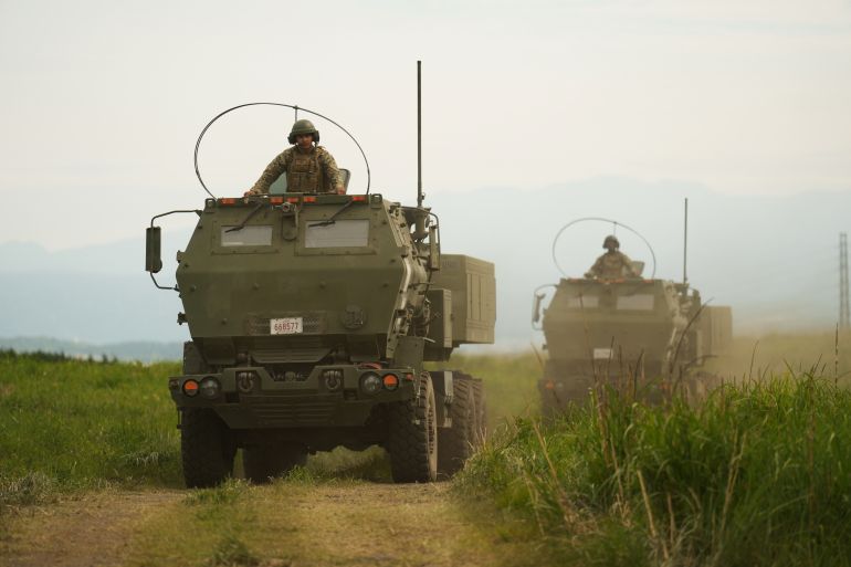 ap_6a1194242fa14-1779536932 U.S. Marines appear to show the High Mobility Artillery Rocket System (HIMARS) mounted on trucks during a media tour after they conducted its live-fire training at Camp Fuji, in Gotemba, southwest of Tokyo, Wednesday, May 20, 2026. (AP Photo/Hiro Komae)