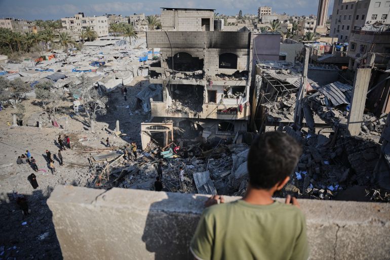 Palestinians inspect the rubble of the Al-Kurd family home, destroyed in an Israeli airstrike in Deir al-Balah, central Gaza Strip, Sunday, May 24, 2026. (AP Photo/Abdel Kareem Hana)