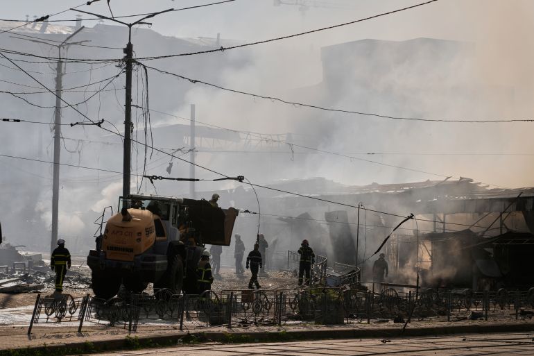 ap_6a130aa4de596-1779632804 Firefighters put out the fire at a city marketplace hit during an intensive Russian air attack, in Kyiv, Ukraine, Sunday, May 24, 2026. (AP Photo/Efrem Lukatsky)
