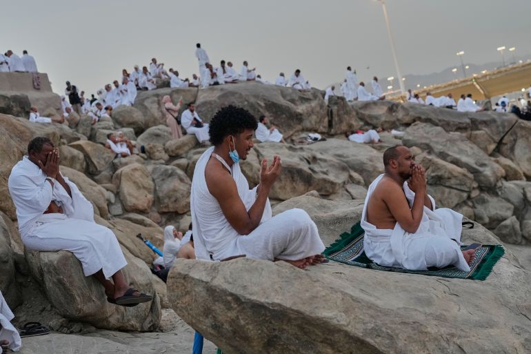 Muslim pilgrims pray at top of the rocky hill known as the Mountain of Mercy, on the Plain of Arafat, during the annual Hajj pilgrimage near the holy city of Mecca, Saudi Arabia, Tuesday, May 26, 2026. (AP Photo/Altaf Qadri)