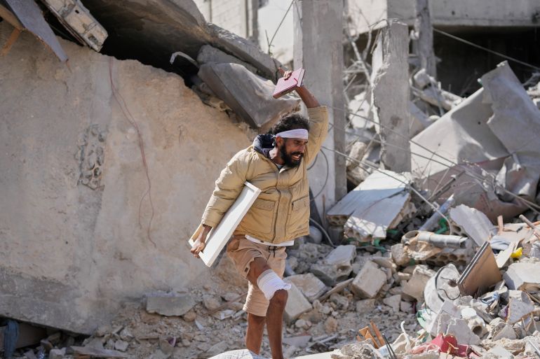 ap_6a178528ae327-1779926312 An injured resident carries belongings through the rubble of his home, a day after it was damaged in an Israeli airstrike in the southern village of Charnay, Lebanon, Wednesday, May 27, 2026. (AP Photo/Mohammed Zaatari)
