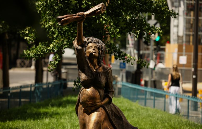 A statue is photographed by French artist Didier Audrat in Paris, Wednesday, May 27, 2026, honoring the memory of the abolition of slavery, depicting Solitude, the daughter of an African slave who was raped by a sailor aboard the ship transporting her to the Caribbean, holding the proclamation of Louis Delgres, an anti-slavery resistance leader calling for resistance and struggle. (AP Photo/Thomas Padilla)