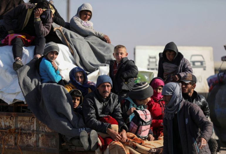 asd3254-1769592961 Displaced people who fled from Aleppo countryside, sit together on the back of a truck in Tabqa, Syria December 3, 2024. REUTERS/Orhan Qereman REFILE - QUALITY REPEAT TPX IMAGES OF THE DAY