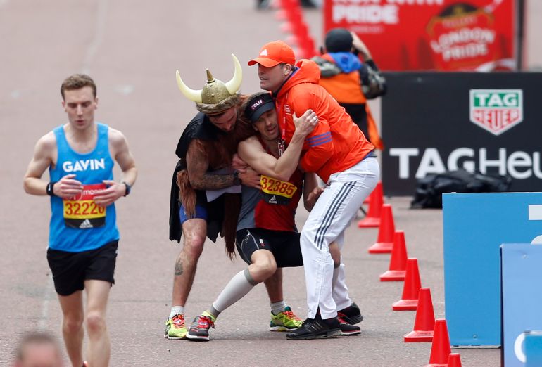 Britain Athletics - London Marathon - London - 23/4/17 A runner collapses just before reaching the finish line on The Mall Action Images via Reuters / Matthew Childs Livepic