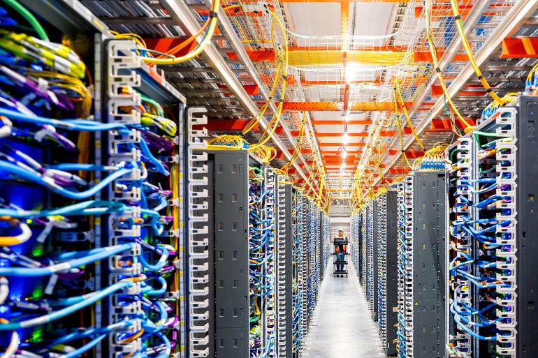 FILE PHOTO: A technician works at an Amazon Web Services AI data center in New Carlisle, Indiana, U.S., October 2, 2025. REUTERS/Noah Berger for AWS/File Photo