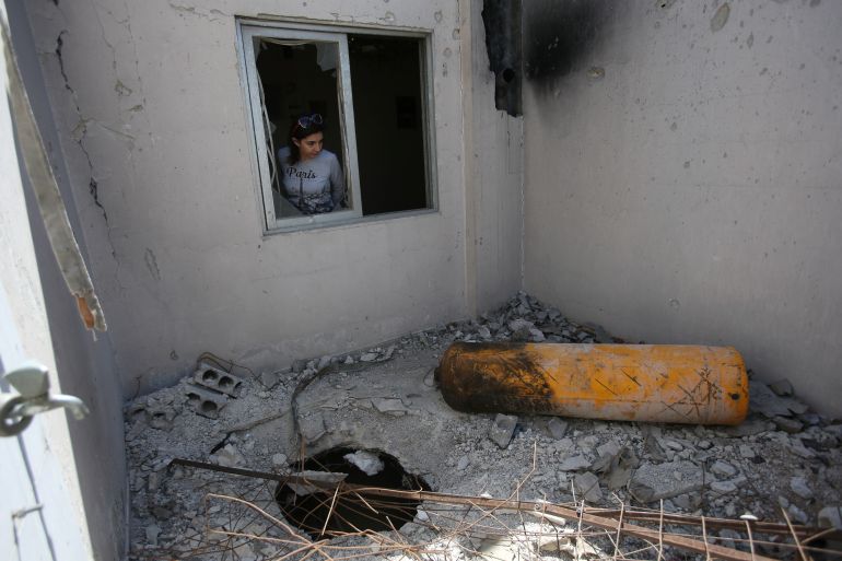 dfgh-1-1779825482 A journalist looks on during a media tour of a damaged house where Organisation for the Prohibition of Chemical Weapons (OPCW) inspectors are belived to have visited in Douma near Damascus, Syria April 23, 2018. REUTERS/ Ali Hashisho