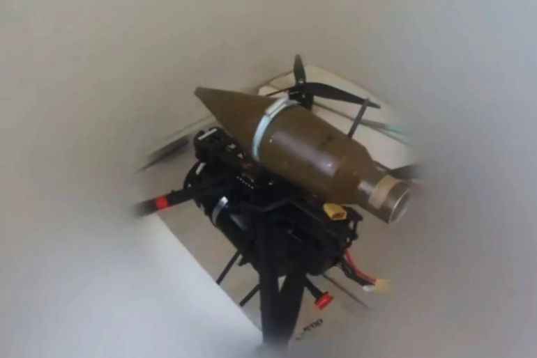 A Hezbollah fighter prepares an FPV (first-person view) drone fitted with a PG-7 warhead at an undisclosed location, in this image released via the group’s media outlets [Social media]