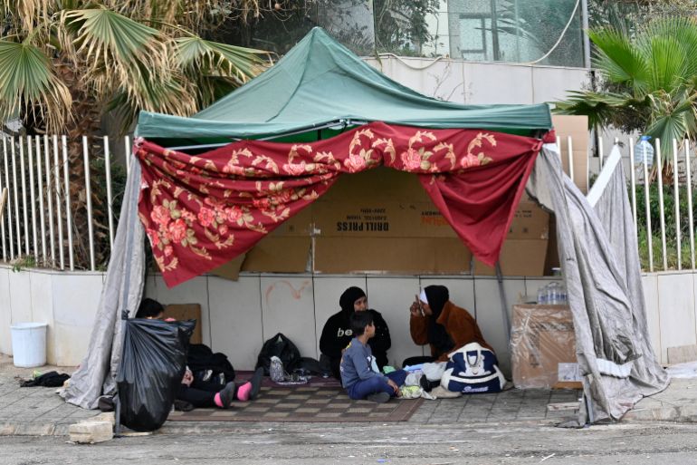 epa_69b2c6406fdb-1773323840 epa12813516 Displaced people who fled Israeli airstrikes in Beirut's southern suburbs sit in a tent on Ramlet Al Bayda public beach in Beirut, Lebanon, 13 March 2026. Lebanese authorities have reported more than 759,000 registered displaced since the escalation began on 02 March 2026, though the true number is likely higher as many stay with relatives or rent in safer areas. EPA/WAEL HAMZEH