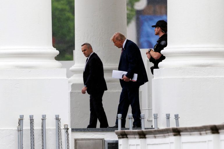 epa12994925 US President Donald Trump (C) leaves the White House in Washington, DC, USA, 26 May 2026. President Trump is travelling to Walter Reed National Military Medical Center for a routine annual medical examination, according to the White House. EPA/WILL OLIVER / POOL