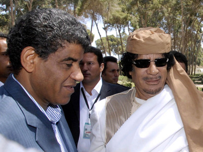 fc7df958-9c53-44ab-88c6-fcfc097b496b epa03228933 (FILE) An undated photograph made available on 20 November 2011, shows Abdullah al-Senussi (L), the former intelligence chief from Muammar Gaddafi's government with former Libyan Leader Muammar Gaddafi (R) at an event in Libya. According to media reports on 21 May 2012, Mauritanian authorities have charged al-Senussi with attempting to enter the country on forged documents. Al-Senussi, who appeared on 20 May in a Nouakchott court amid heavy security, was remanded to the city's central prison on 21 May. EPA/SABRI ELMHHEDWI UNDATED IMAGE