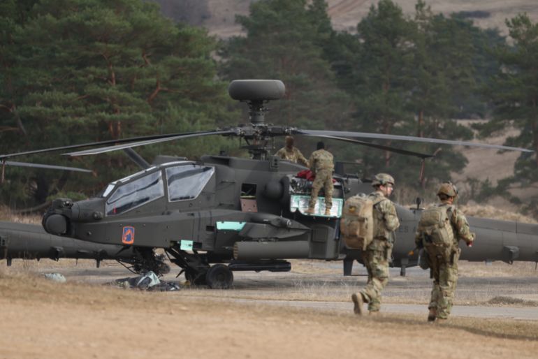 HOHENFELS, GERMANY - MARCH 12: Crew members ready a Boeing AH-64 Apache attack helicopter of the U.S. Army 12th Combat Aviation Brigade during the Allied Spirit 25 military exercise at the U.S. 7th Army Training Command Joint Multinational Readiness Center on March 12, 2025 near Hohenfels, Germany. Approximately 3,000 troops from NATO member countries, including the United States, Austria, the Czech Republic, France, Hungary, Italy, Spain, Latvia, Lithuania, North Macedonia, Slovakia, Slovenia and the United Kingdom, are participating in the four-week exercise with the aim of improving interoperability. European countries have pledged large-scale defence spending following doubts cast by the administration of U.S. President Donald Trump on the future of the U.S. commitment to the NATO military alliance. (Photo by Sean Gallup/Getty Images)