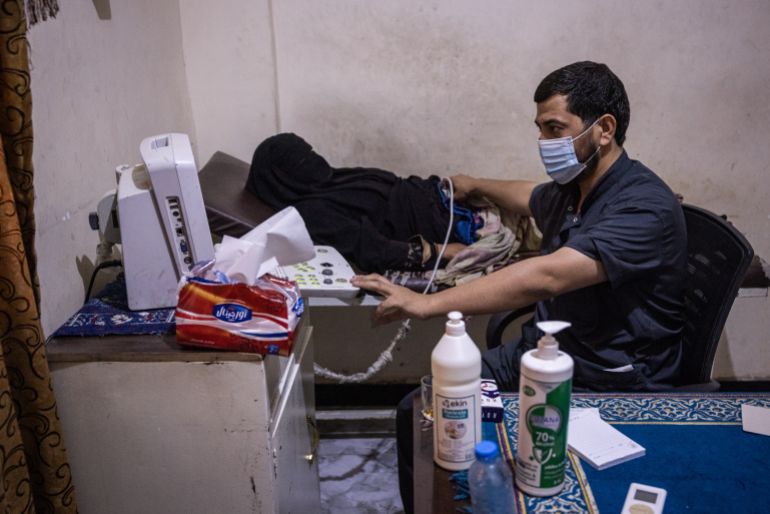 getty_690ad31575-1762317077 DEIR EZ-ZUR, SYRIA - JUNE 22: A woman receives an ultrasound scan in Abu Hamam Hospital June 22, 2025 in Deir Ez-Zur, Syria. Medical clinics in Syria have been overwhelmed as some NGO-supported facilities have been forced to close due to cuts to foreign-aid budgets, most notably the dismantling of the United States Agency for International Development (USAID) earlier this year. Staff at Abu Hamam Hospital, which is financed by the US-backed Syrian Democratic Force (SDF), who are in control of swaths of Syrian territory to the west of the Euphrates river, said they had noticed an increase in the number of patients needing treatment in the months since NGO funding had been reduced earlier in 2025. As Syria rebuilds from a 13-year civil war, the country's health services are largely dependent on NGOs in the absence of a more robust and organized healthcare system. (Photo by Ed Ram/Getty Images)