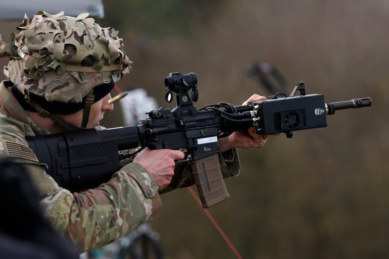 OLDENBURG IN HOLSTEIN, GERMANY - NOVEMBER 21: A participant uses a drone defense rifle of exhibitor AG3 Labs Inc. during a live presentation as part of the Project Flytrap 4.5 exercise of counter-drone technologies at the Putlos military training center on November 21, 2025 at Putlos, Germany. NATO's Allied Land Command and U.S. Army Europe and Africa are working to identify, test, and evaluate both combat-proven capabilities and emerging technology counter-drone systems for land forces. (Photo by Morris MacMatzen/Getty Images)