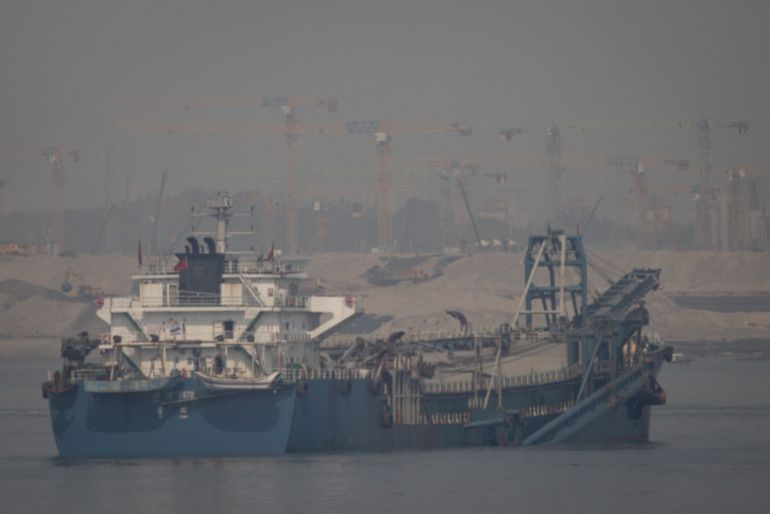 getty_69e1200e7c-1776361486 KINMEN, TAIWAN - APRIL 10: A Chinese flagged sand dredge works in the waters between Taiwan and the Chinese city of Xiamen on April 10, 2023 in Kinmen, Taiwan. Kinmen, an island in the Taiwan strait that is part of Taiwan's territory, is so close to China that the deep-water port of Xiamen, one of China's biggest, lies less than three miles away across the water. It is one of the few areas of Taiwan that mainland Chinese tourists can visit without visas or permits, and has deep ties with the adjacent Fujian province of China; locals have seen a boost to their incomes from Chinese tourism in pre-pandemic times. Wartime anti-tank barricades litter the beach and also features the Zhaishan tunnel, which Taiwanese forces still reserve the right to use in wartime and for military exercises. (Photo by Chris McGrath/Getty Images)