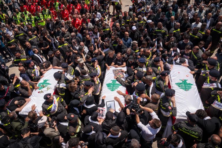 TYRE, LEBANON - APRIL 30: The coffins of Hussein Ghadbouni, Hadi Daher, Hussein Sati arrive to the funeral ceremony on April 30, 2026 in Tyre, Lebanon. The Lebanese Ministry of Health confirmed three members of the Lebanese Civil Defense were killed in an Israeli airstrike on Tuesday while responding to an initial strike on a building in the southern town of Majdal Zoun. The successive strikes killed nine people and wounded 17 others. (Photo by Adri Salido/Getty Images)