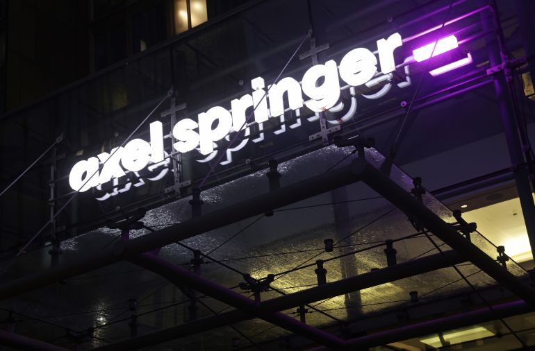 BERLIN, GERMANY - OCTOBER 26: The corporate headquarters of Axel Springer SE stands at twilight on October 26, 2023 in Berlin, Germany. Axel Springer is Europe's largest publishing company in electronic and print media. It owns the Bild tabloid and Welt newspaper as well as Politico and Business Insider. (Photo by Sean Gallup/Getty Images)