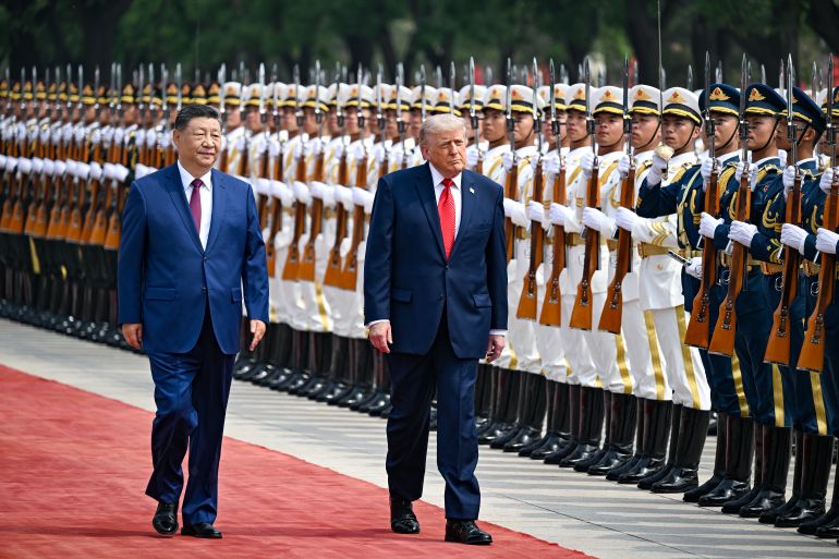 BEIJING, CHINA - MAY 14: U.S. President Donald Trump reviews an honor guard with Chinese President Xi Jinping during a welcome ceremony at the Great Hall of the People on May 14, 2026 in Beijing, China. President Trump is meeting with President Xi Jinping in Beijing to address the Iran conflict, trade imbalances, and the Taiwan situation while establishing new bilateral boards for economic and AI oversight. (Photo by Kenny Holston-Pool/Getty Images)
