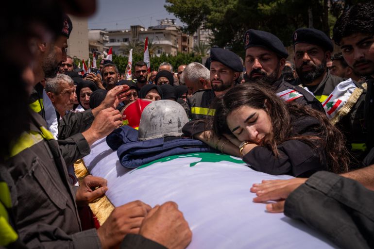 getty_6a0e5ae704-1779325671 SIDON, LEBANON - MAY 13: Colleagues and relatives of the Civil Defense killed in a IDF airstrike during the funeral ceremony on May 13, 2026 in Sidon, Lebanon. Despite last month's ceasefire agreement between Israel and Lebanon, Israel has conducted regular strikes in the southern part of the country citing the continued threat of Hezbollah, the Iran-backed militant group. (Photo by Adri Salido/Getty Images)