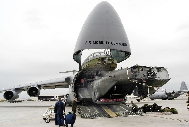 getty_6a0f44de73-1779385566 SIGONELLA, SICILY - MARCH 14: An MH-53E Sea Dragon assigned to the "Blackhawks" of Helicopter Mine Counter Measures Squadron 15 is offloaded from a U.S. Air Force C-5 Galaxy March 14, 2003 at the U.S. naval base at Sigonella, Sicily. The Sea Dragon is deployed in support of naval vessels in the Mediterranean Sea. The base provides logistical support for the Sixth Fleet and NATO forces when in the Mediterranean Sea. (Photo by Damon J. Moritz/U.S. Navy/Getty Images)