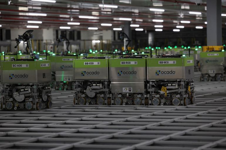 getty_6a11900f9a-1779535887 LUTON, ENGLAND - JULY 2: automated packing robots are shown during a visit by British Prime Minister Rishi Sunak to the Ocado distribution centre at a Conservative general election campaign event on July 2, 2024 near Luton, England. Labour currently holds a 20-point lead over the Conservatives, according to the latest Ipsos poll. Just over a third of voters say they may change their mind before polling day. (Photo by Phil Noble-WPA Pool/Getty Images)